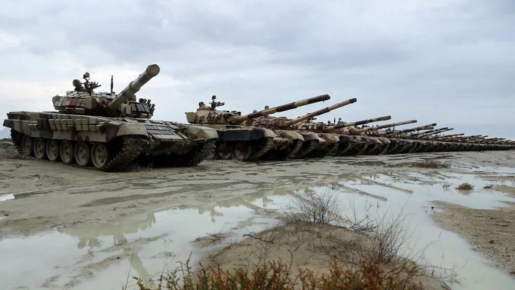 A handout picture provided by the Iranian Army office on 31 December, 2022, shows Iranian troops during a military drill in Makran beach on the Gulf of Oman, near the Hormuz Strait (Iranian Army office/AFP)