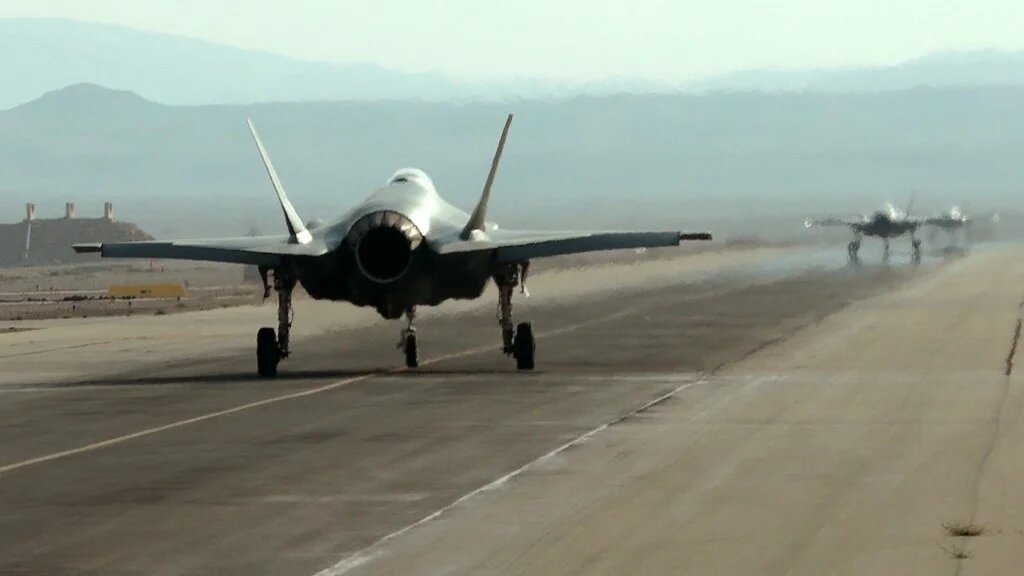 F-35 fighter jets roll on the tarmac during a multinational aerial exercise at the Ovda air force base in Israel in 2019 (Emmanuel Dunand/AFP)