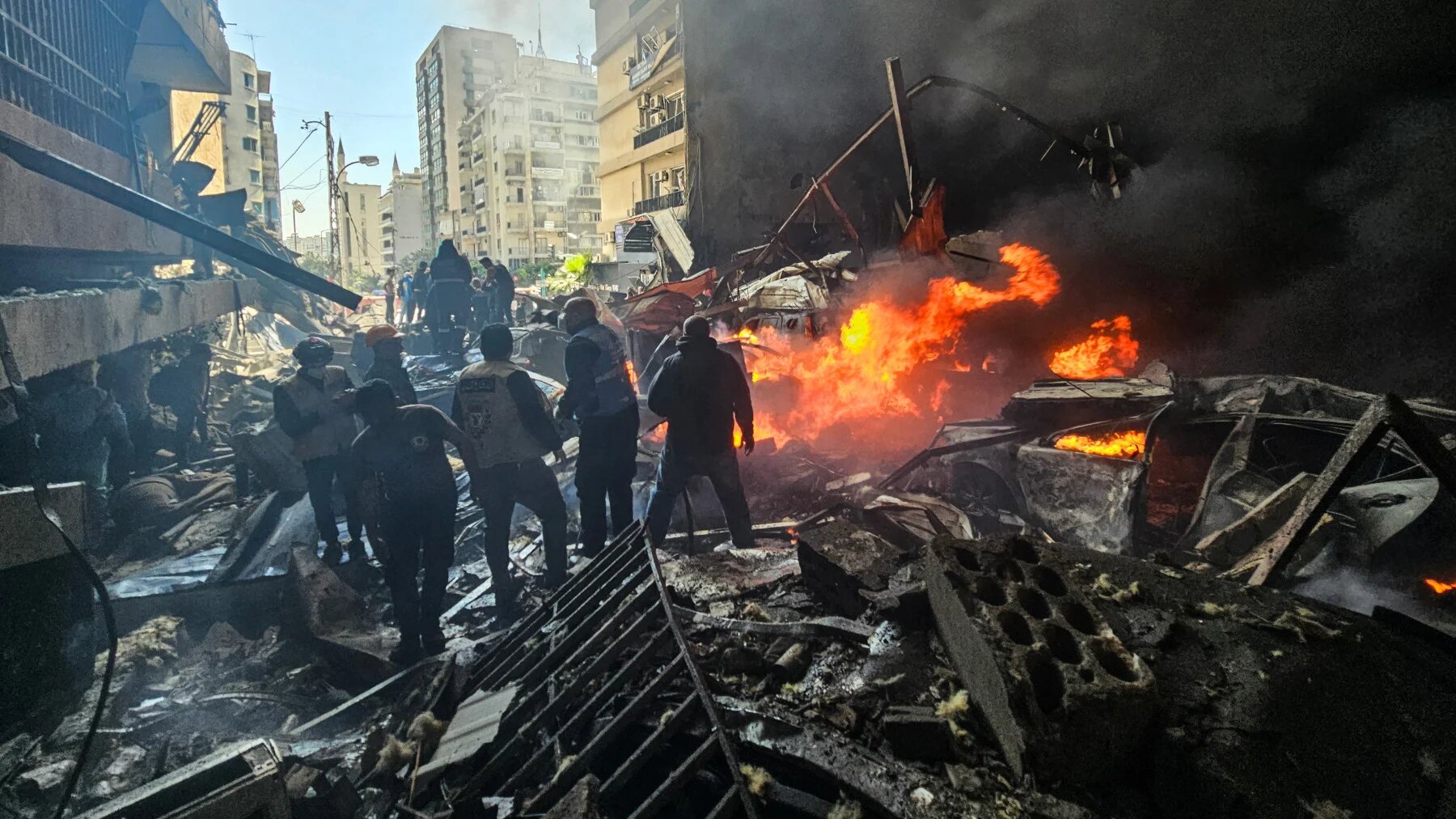 First responders stand amid rubble at the site of an Israeli air strike in Beirut's Corniche al-Mazraa neighbourhood on 8 April 2026 (AFP)