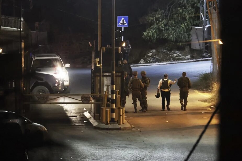 Israeli security forces patrol an area on the outskirts of Hebron, in the southern West Bank, after a gun attack on 29 October 2022 (AFP)