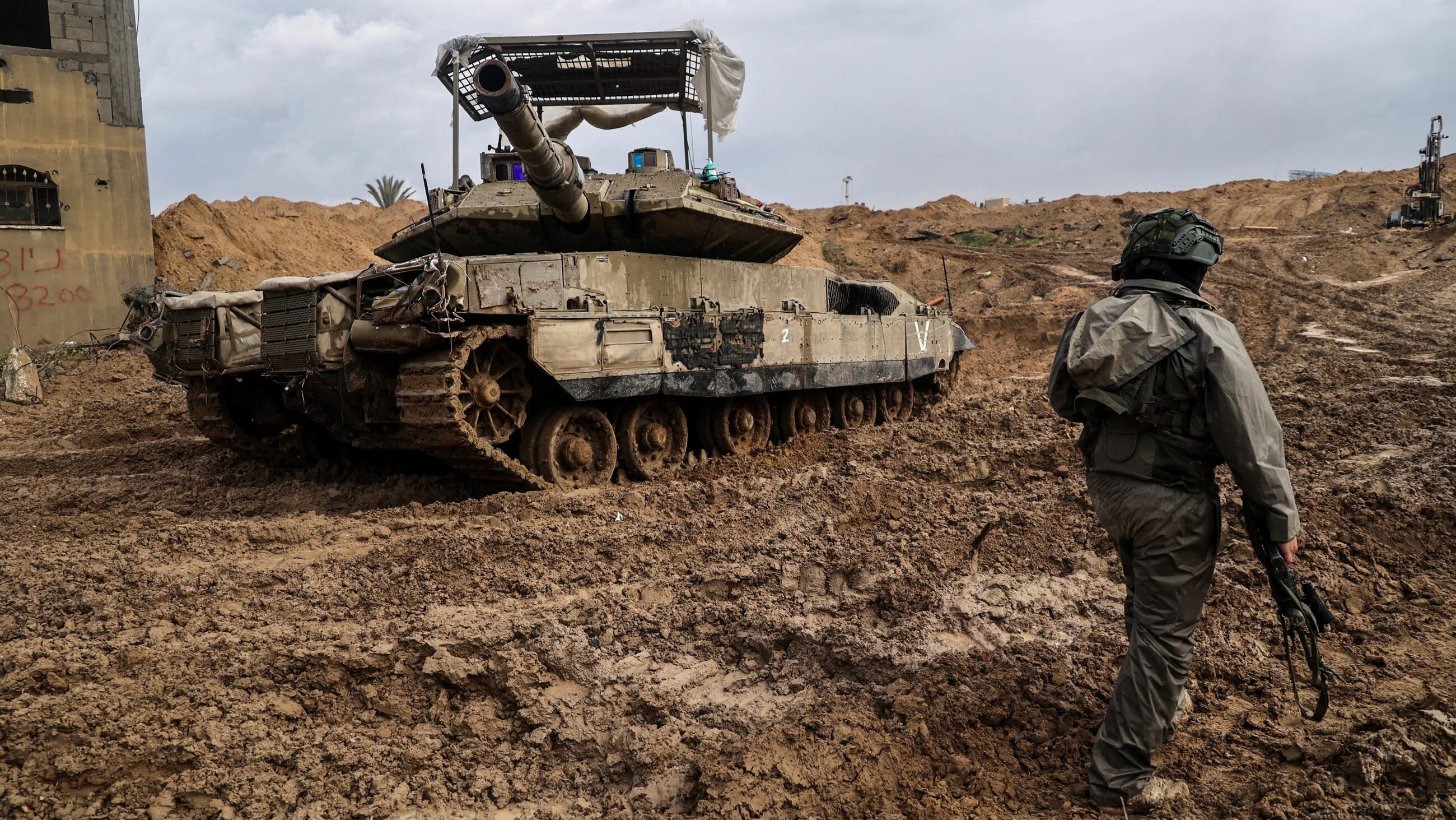 An Israel soldier standing near a tank in Khan Younis, in Southern Gaza