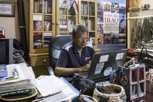 Jassim al-Assadi, director of Nature Iraq, in his office in Chibayish, 120kms northwest of the southern city of Basra, 29 March 2019 (AFP)