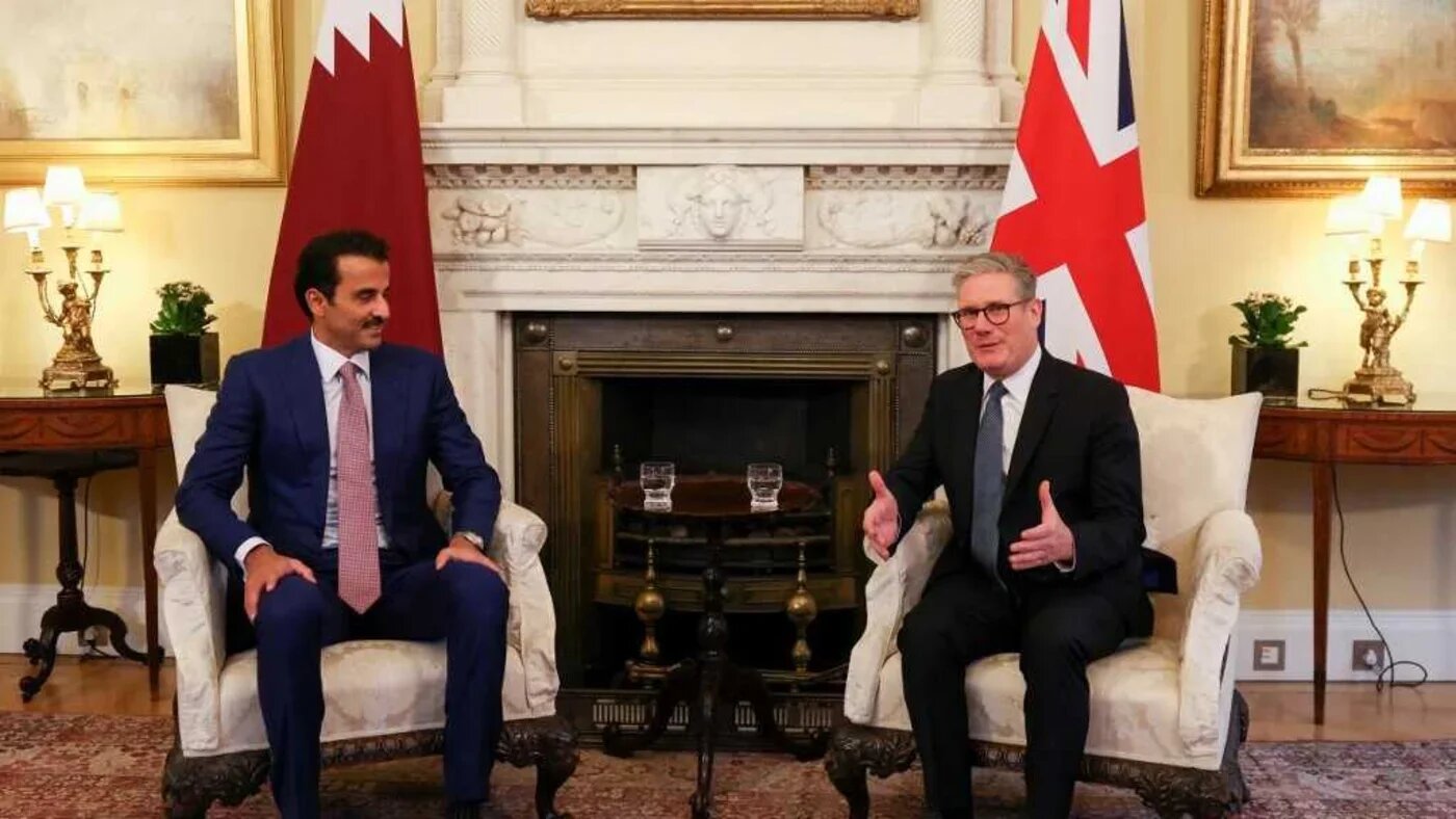 Britain's Prime Minister Keir Starmer (R) speaks with Qatar's Emir Sheikh Tamim bin Hamad Al Thani (L) at 10 Downing Street in London, on 4 December 2024 (AFP)