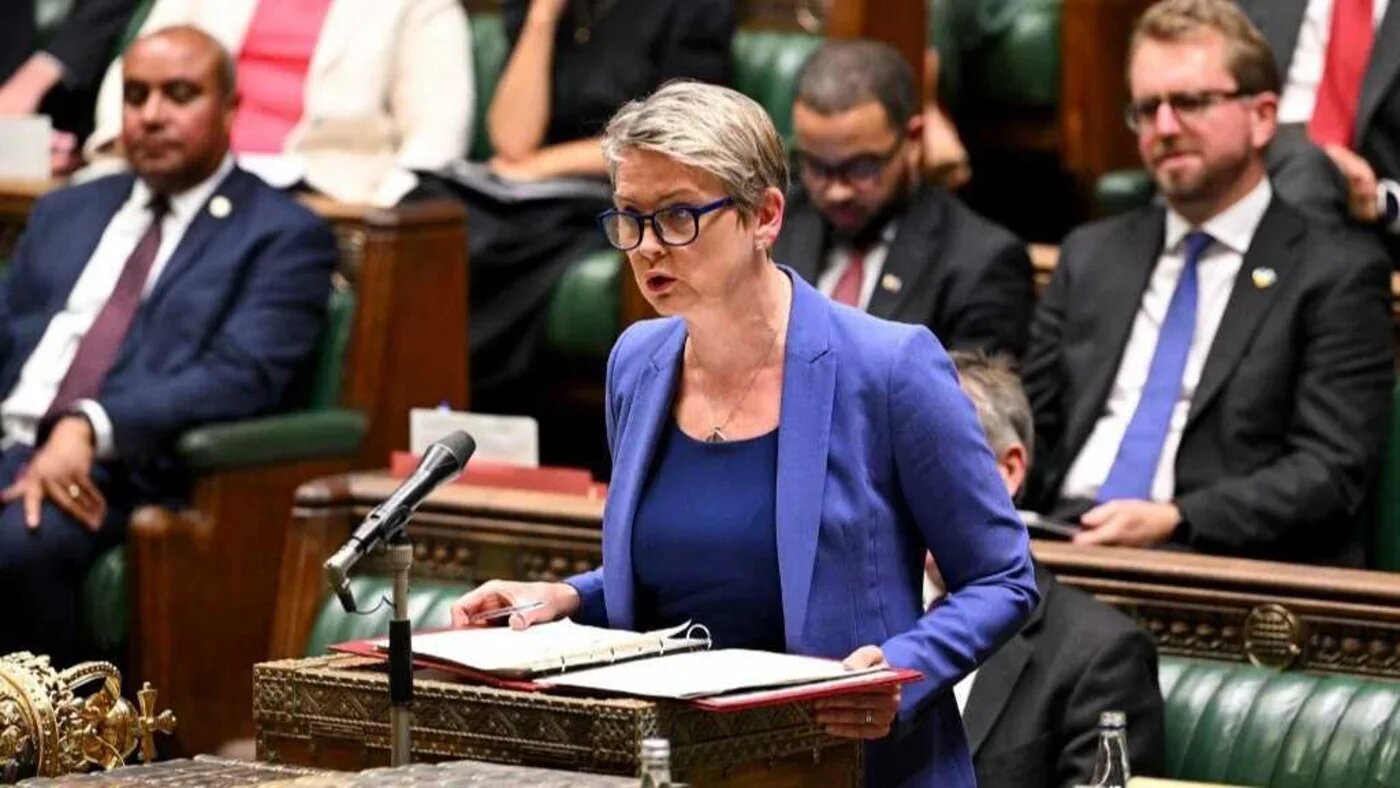 Then-Home Secretary Yvette Cooper, now foreign secretary, delivering a speech in the House of Commons on 1 September (AFP)