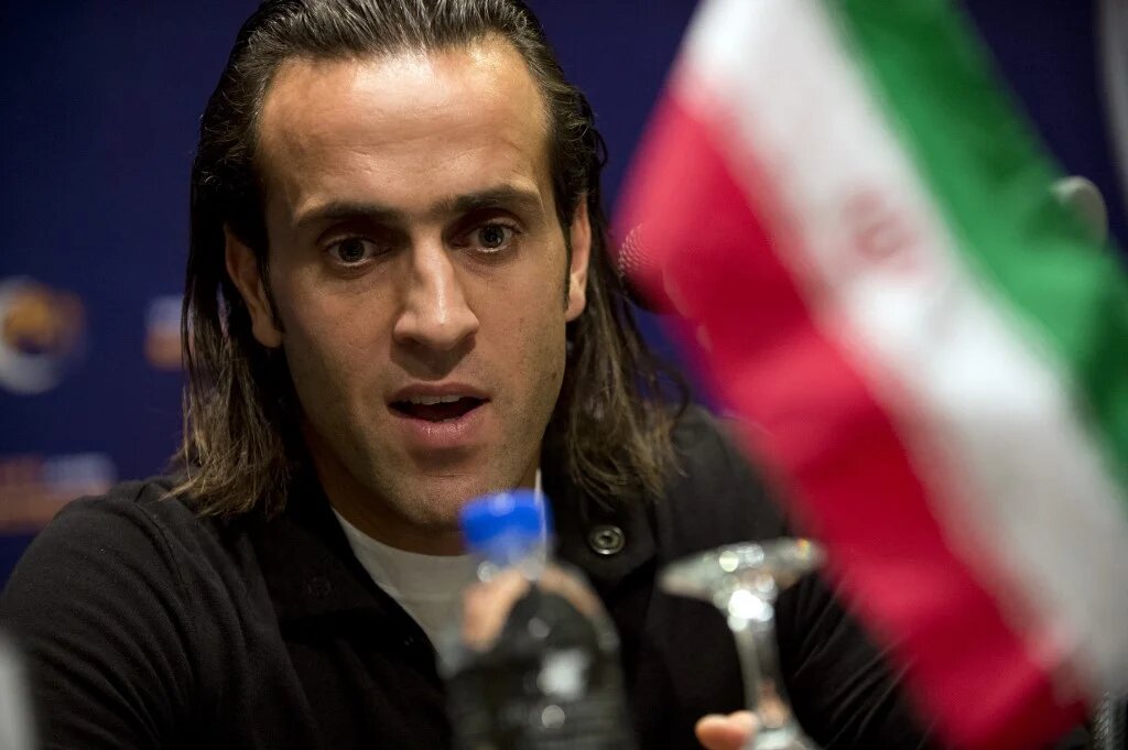 Former Iranian midfielder Ali Karimi speaks at a press conference in Kuala Lumpur on 28 November 2012 (AFP)
