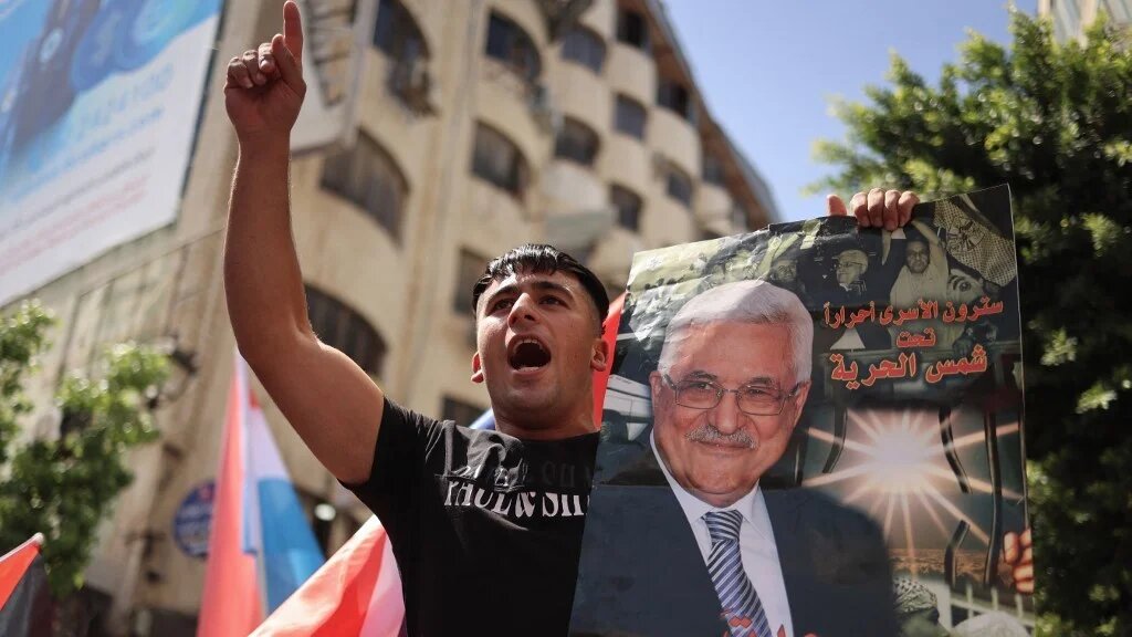 A Palestinian chants slogans during a gathering in Ramallah in the occupied West Bank on 23 September 2025, to express their support for president Mahmoud Abbas and countries formally recognising the state of Palestine (Zain Jaafar/AFP)