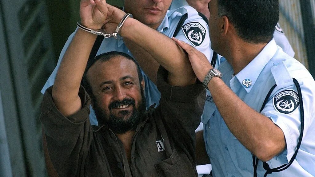 Marwan Barghouti on his way back to jail in September 2003 after appearing before a Tel Aviv court (Tal Cohen/AFP)