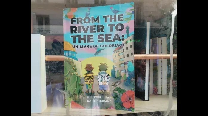 Children's colouring book 'From the River to the Sea', by South African author and illustrator Nathi Ngubane, is displayed in the window of Paris bookshop Violette and Co (Social media)