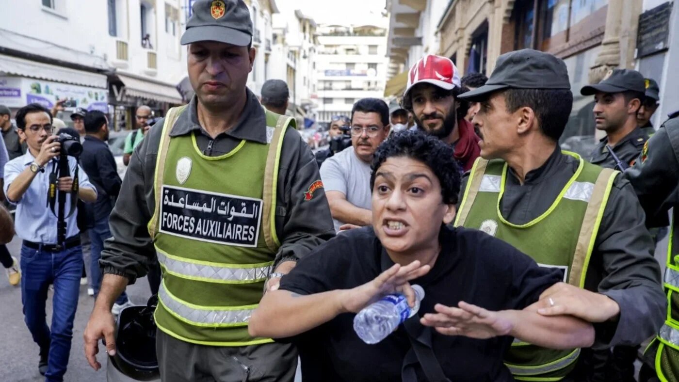 Moroccan security forces detain a protester during a youth-led demonstration for social justice outside the parliament building in Rabat on 27 September 2025 (Abdel Majid Bziouat/AFP)