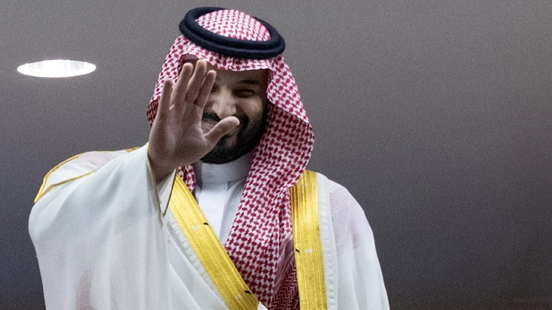 Saudi Arabia's Crown Prince Mohammed bin Salman greets spectators as he attends the King's Cup final match between Ittihad FC and Qadsiah FC at the King Abdullah Sport City Stadium in Jeddah on May 30, 2025 (Abdel Ghani BASHIR / AFP)