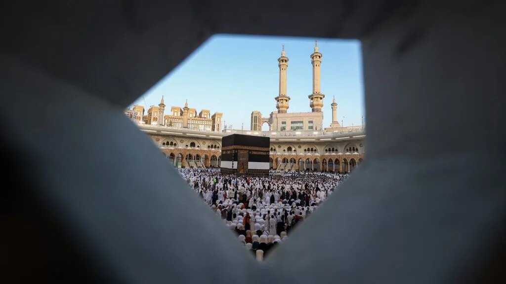 Muslims participate in a special morning prayer around the Kaaba, Islam's holiest shrine, at the Grand Mosque complex in Mecca (AFP)