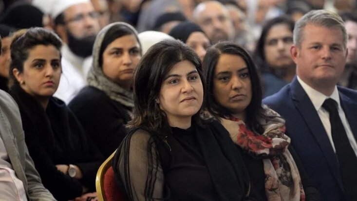 Sayeeda Warsi (C) at a vigil for Jo Cox, the day after the Labour MP had been murdered by a far-right terrorist in Birstall, Yorkshire, 17 June 2016 (Oli Scarff/AFP)