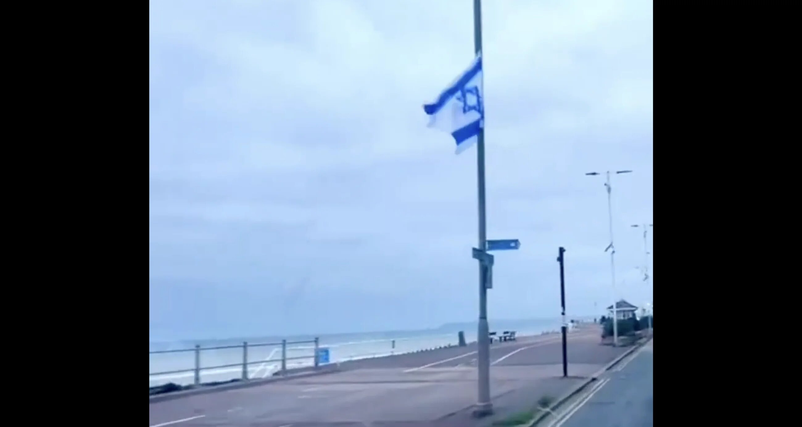 Israeli flags line the promenade of Hastings seafront, 7 October 2025, Hastings, UK (Source: Screenshot/X)