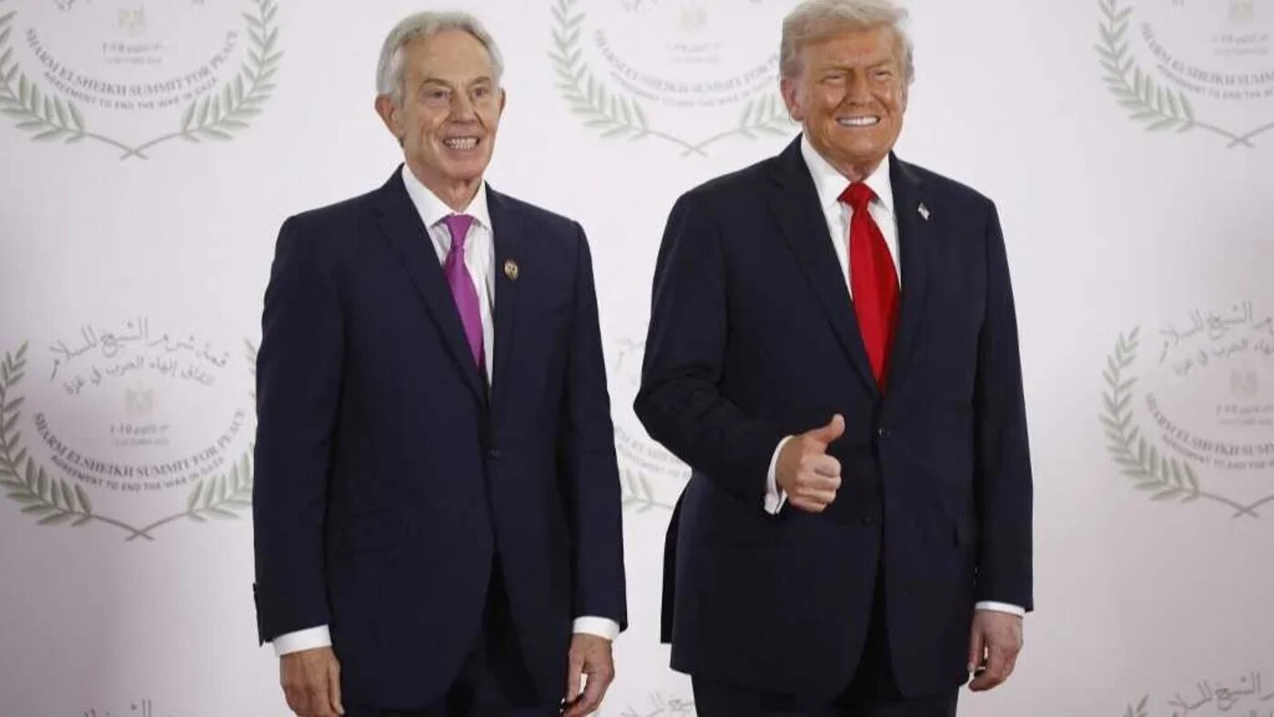 Former British prime minister Tony Blair and US President Donald Trump pose at a summit on Gaza in Sharm el-Sheikh on 13 October (AFP)
