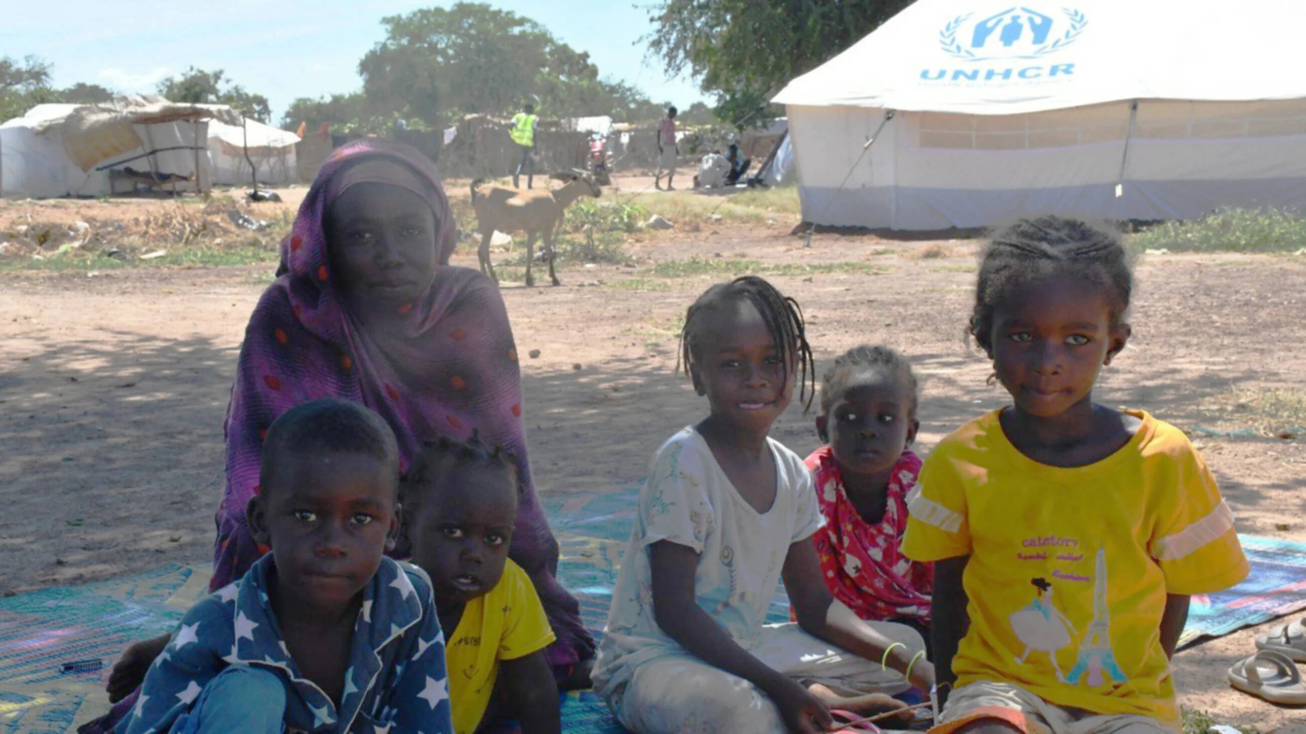 A refugee mother and children who escaped fighting in South Darfur's capital, Nyala, at Wedwiel refugee settlement in South Sudan (MEE/Okech Francis)