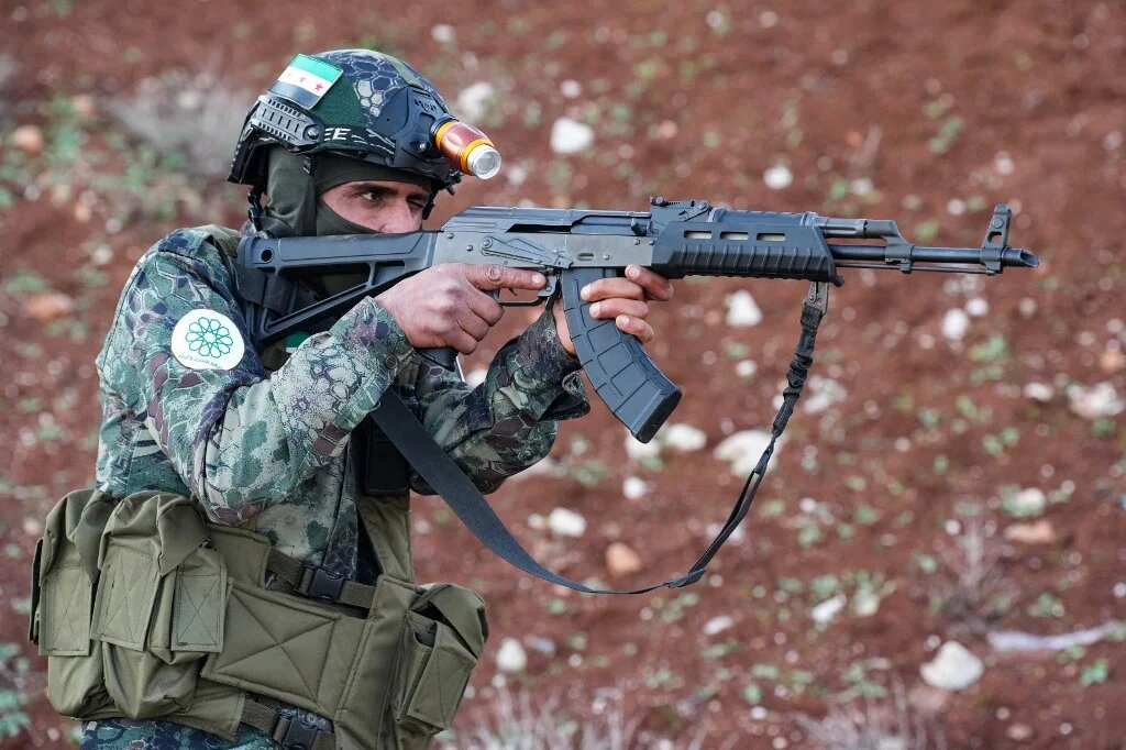 In this picture, taken on 18 December 2023, a Syrian opposition fighter trains near the border with Turkey (AFP/Rami al-Sayed)