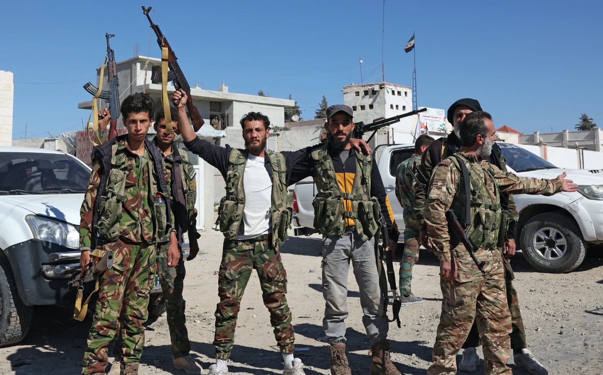 Fighters from the Turkish-backed Free Syrian Army are deployed on a checkpoint in the area of Kafr Jannah on the outskirts of the Syrian town of Afrin on 19 October 2022 (AFP)