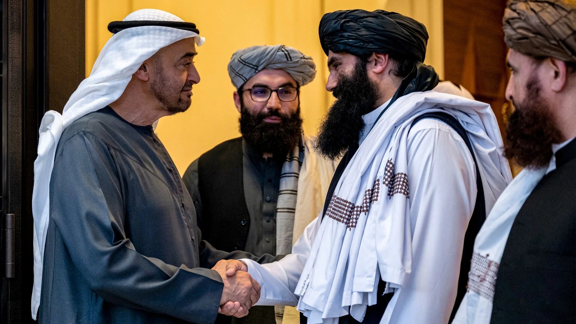 Mohamed bin Zayed (L) bidding farewell to Sirajuddin Haqqani (2nd-R) in Abu Dhabi on 3 June (Abdulla al-Bedawawi/UAE presidential court/AFP)
