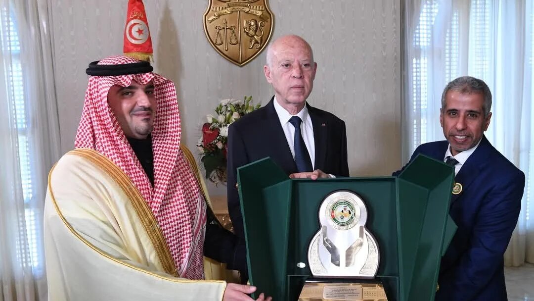 Saudi Interior Minister Prince Abdulaziz bin Saud, Tunisian president Kais Saied and AIMC Secretary General Mohammed Bin Ali Kuman at the AIMC annual conference in Tunis last week (@AIMC_MOfficial/X)