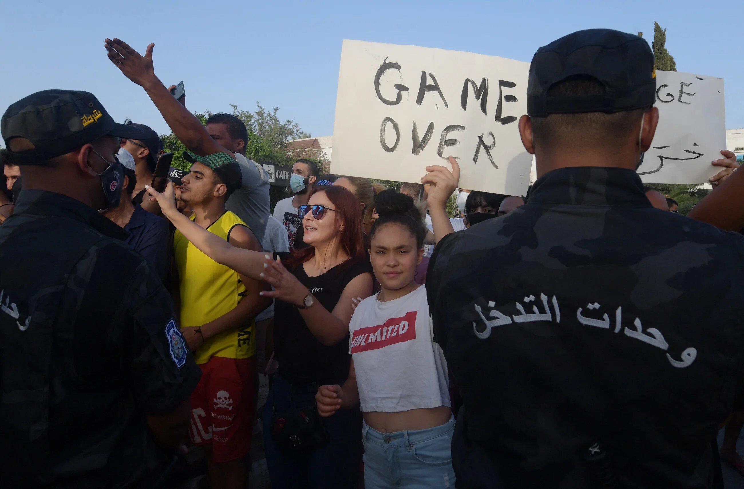 Supporters of Tunisian President Kais Saied chant slogans denouncing Ennahda party leader Rached Ghannouchi in front of the Parliament in the capital Tunis on 26 July 2021.