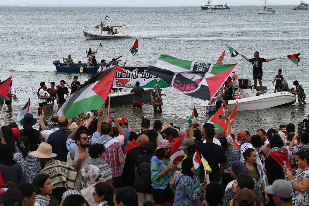 Supporters and activists of the Global Sumud Flotilla gather at the Tunisian port of Sidi Bou Said on 10 September 2025 (Fethi Belaid/AFP)