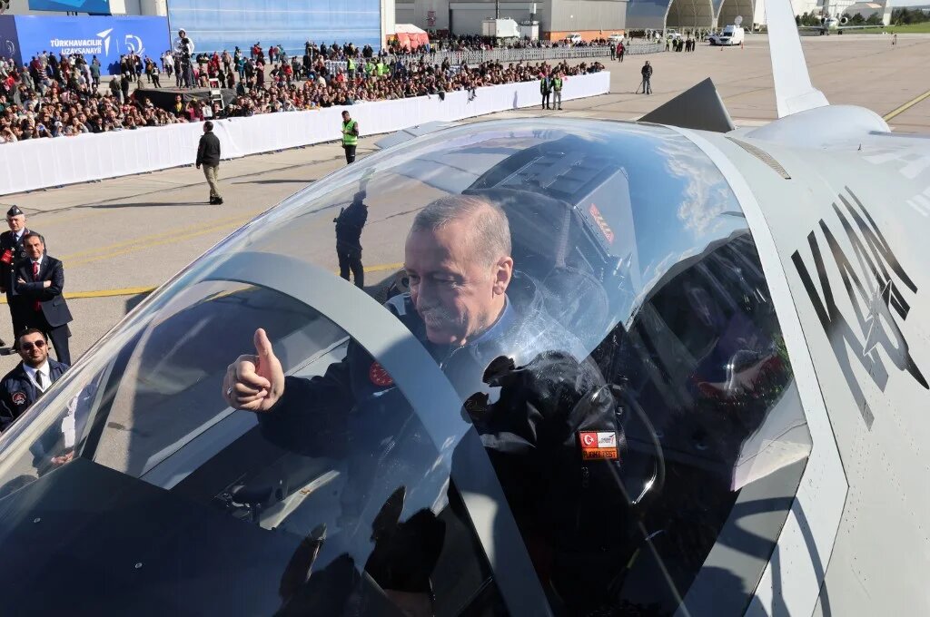 Turkish President Recep Tayyip Erdogan sits in the cockpit of Turkey's national combat "KAAN" at the Turkish Aerospace Industries Headquarters to introduce new aircraft in Ankara on 1 May 2023. (Handout/ AFP)