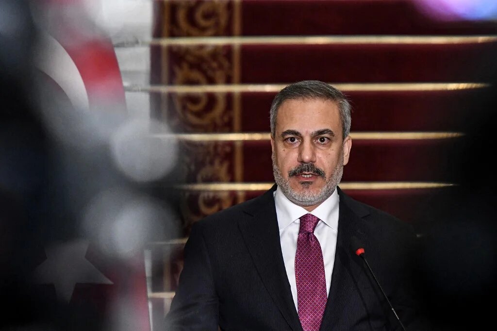 Turkey's Foreign Minister Hakan Fidan during a joint press conference with the Egyptian foreign minister in Cairo on 14 October 2023 (AFP)