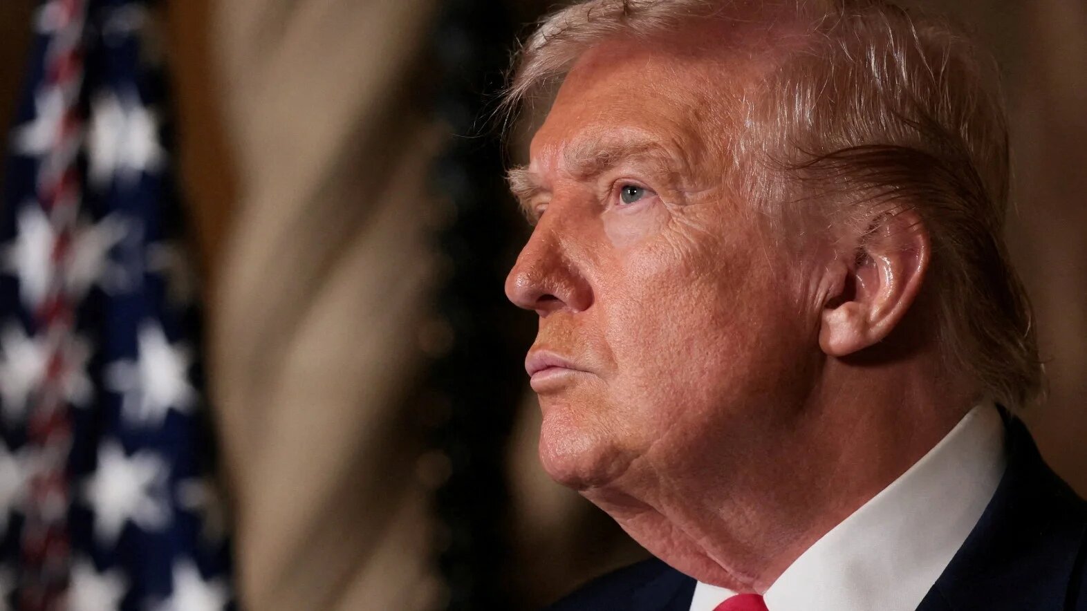 US President Donald Trump speaks to reporters at Mar-a-lago in Palm Beach, Florida on 22 December 2025 (Jessica Koscielniak/Reuters)