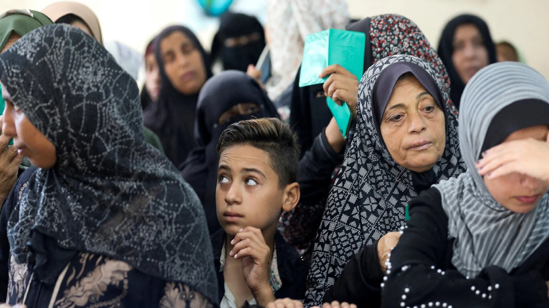 Palestinians gather as they register for medical check ups at a health centre run by Unrwa in Deir Al-Balah, in the central Gaza Strip, 29 October (Reuters/Ramadan Abed)