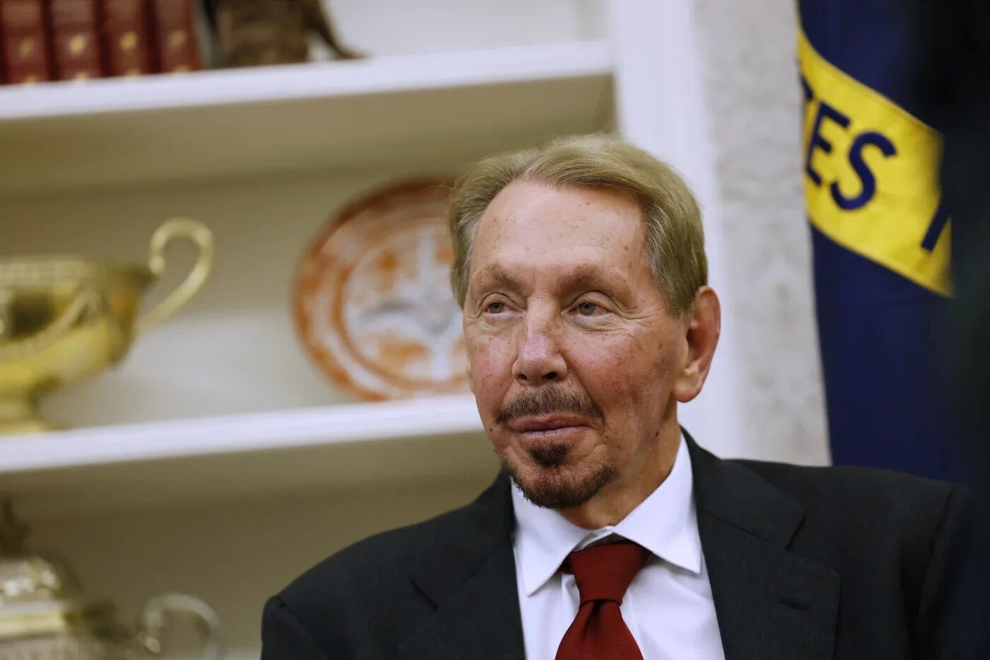 Larry Ellison listens as US President Donald Trump speaks to reporters in the White House on 3 February 2025 (Anna Moneymaker/Getty Images via AFP)