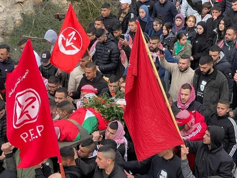 Mourners carry the body of Adam Essam Ayyad (Akram al-Waara)