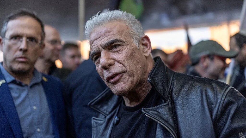 Yair Lapid, leader of the opposition in the Israeli government, joins a rally supporting the Israeli military draft and calling for ultra-Orthodox Jews to enlist for military service, in Jerusalem on 15 January 2026 (Ilia Yefimovich/AFP)