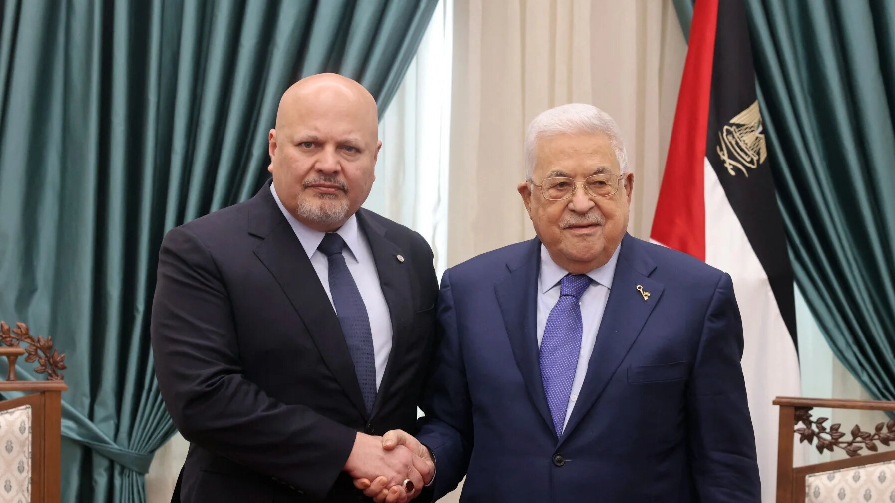 Palestinian President Mahmud Abbas (R) meeting with the Prosecutor of the International Criminal Court Karim Khan in Ramallah in the occupied West Bank on 2 December 2023 (Thaer GHANAIM/PPO/AFP)