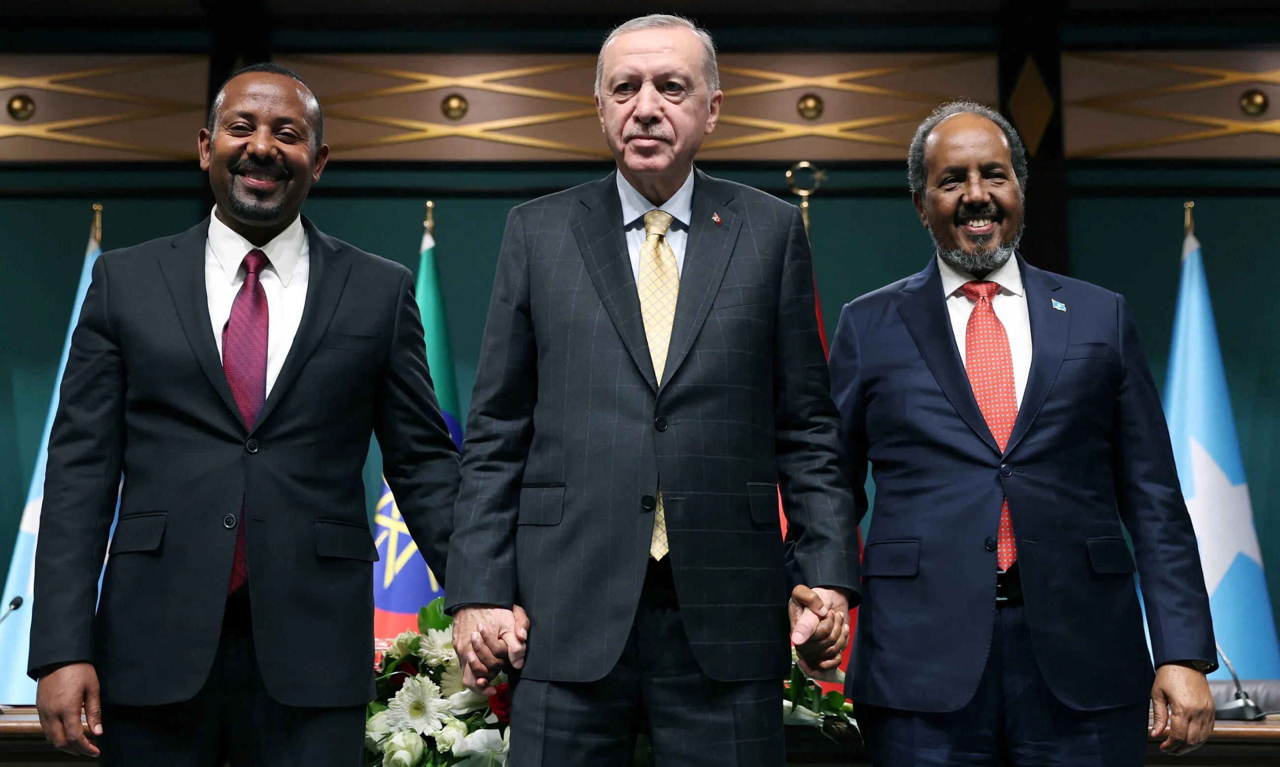 Ethiopian Prime Minister Abiy Ahmed (left), Turkish President Recep Tayyip Erdogan (centre) and Somali President Hassan Sheikh Mohamud pose after signing the Ankara Declaration on 11 December in Ankara (Turkish Presidency/Handout)