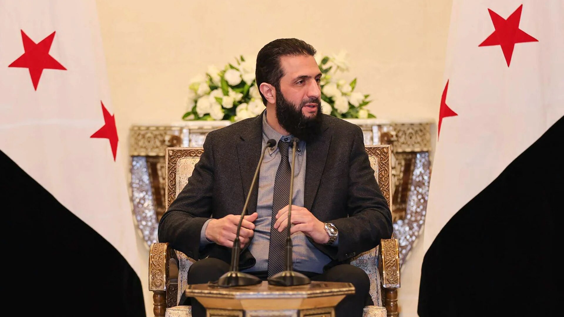 Syria's new leader and Hayat Tahrir al-Sham (HTS) chief Ahmed al-Sharaa meeting with local industrialists in Damascus on 10 January 2025 (AFP/Syria's transitional government)