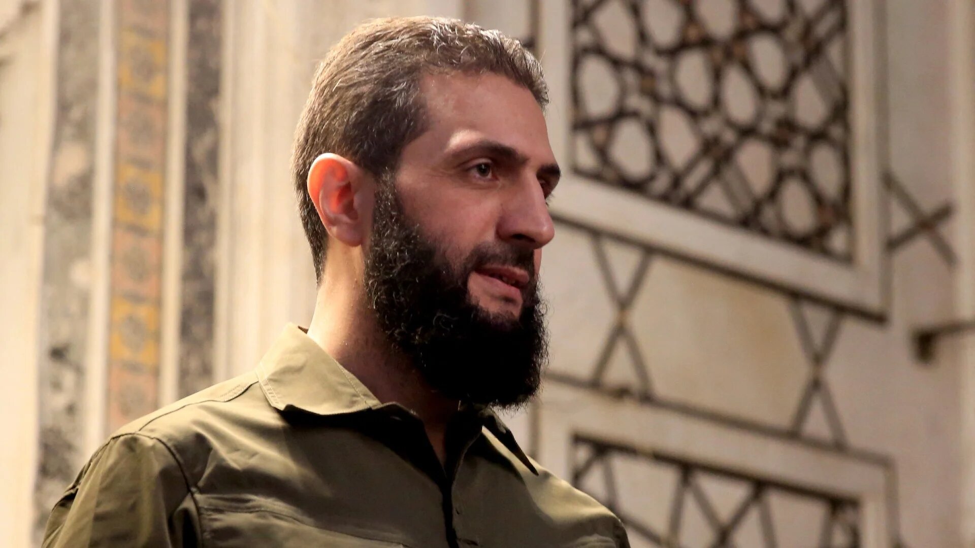 The leader of Syria's Hayat Tahrir al-Sham Ahmed al-Sharaa address a crowd at the Umayyad Mosque in Damascus on 8 December 2024 (AFP/Aref Tammawi)