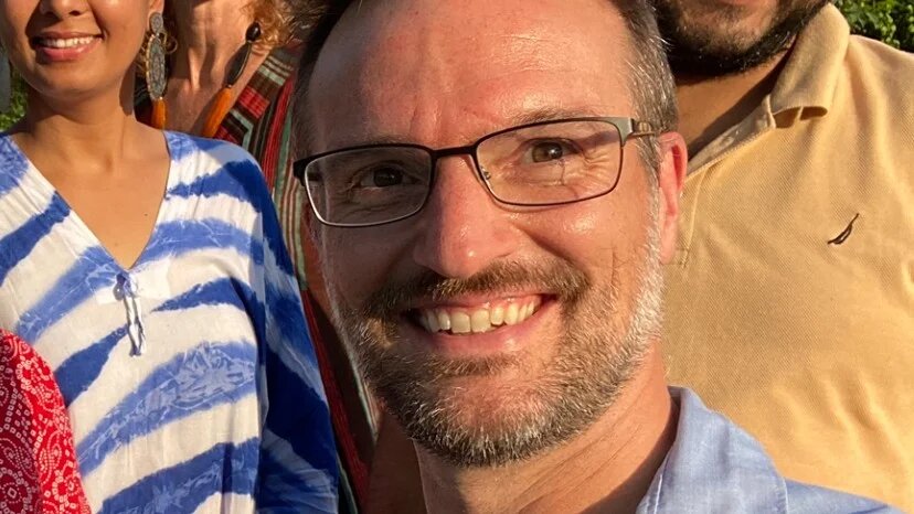 Alexander Smith takes a photo with the USAID mission in Nepal in October last year.