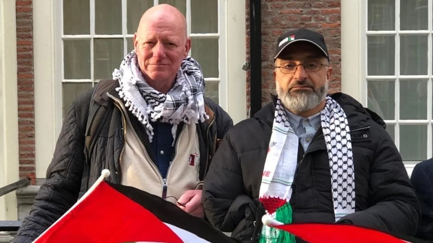 Amin Abu Rashed (right) stands next to Oscar Bergamin (left), a friend and the campaign spokesperson calling for the release of Abu Rashed  (MEE/Supplied)