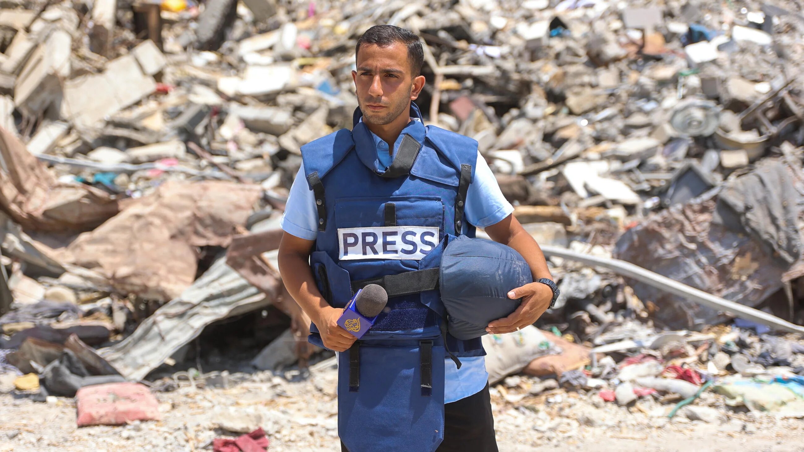Al-Jazeera correspondent Anas al-Sharif reports near the Arab Ahli Hospital in Gaza City on 10 October, 2024 (AFP)
