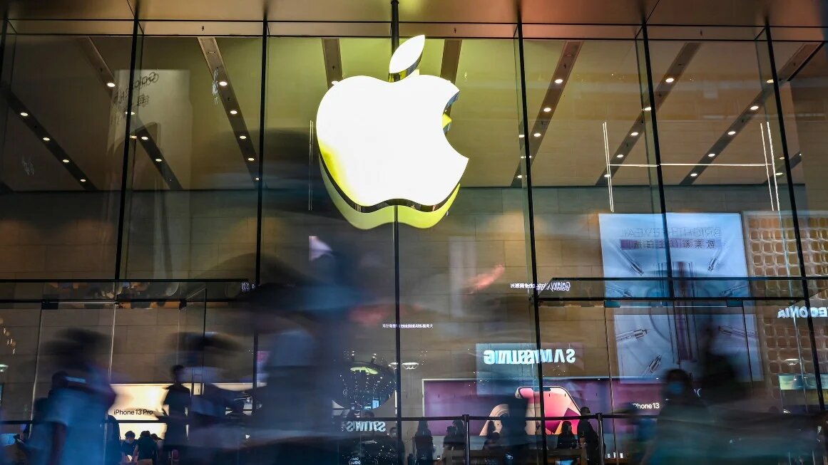 People walk past an Apple store in Shanghai on 5 October 2021.