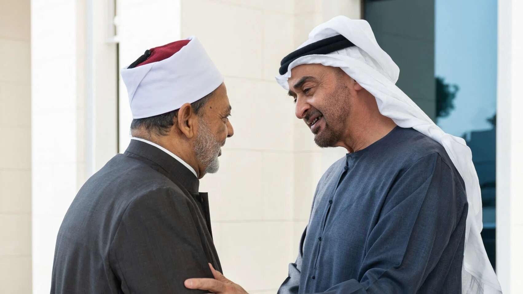 This handout picture provided by the UAE Presidential Court shows UAE President Mohammed bin Zayed Al Nahyan (R) receiving Ahmed al-Tayeb, grand imam of al-Azhar and chairman of the Muslim Council of Elders, at al-Shati Palace in Abu Dhabi on July 12, 2024. Abdulla AL-NEYADI / UAE PRESIDENTIAL COURT / AFP
