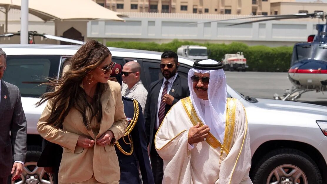 US Homeland Security Secretary Kristi Noem (L) is received by Bahrain's Minister of the Interior Rashid bin Abdullah al-Khalifa in Manama on 25 May 2025 (Alex Brandon/AFP)