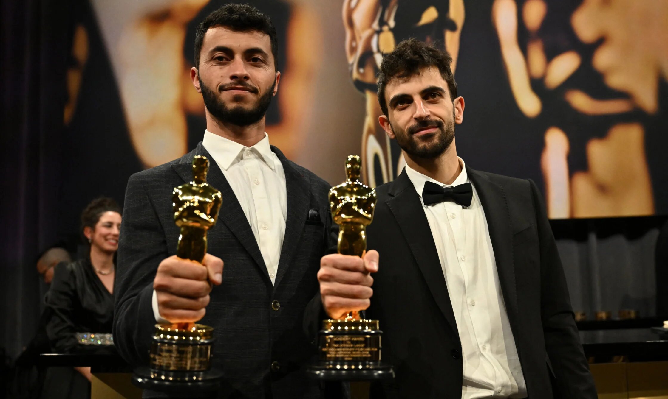 Basel Adra and Yuval Abraham attend the 97th Annual Academy Awards Governors Ball at the Dolby Theatre in Hollywood, California on 2 March 2025 (AFP)