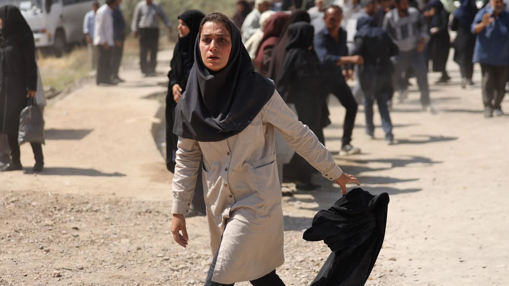 A blind man protects female fugitive Leila from the police in Ali Jalilvand's 'Beyond the Wall' (Mehr Taha Studio)