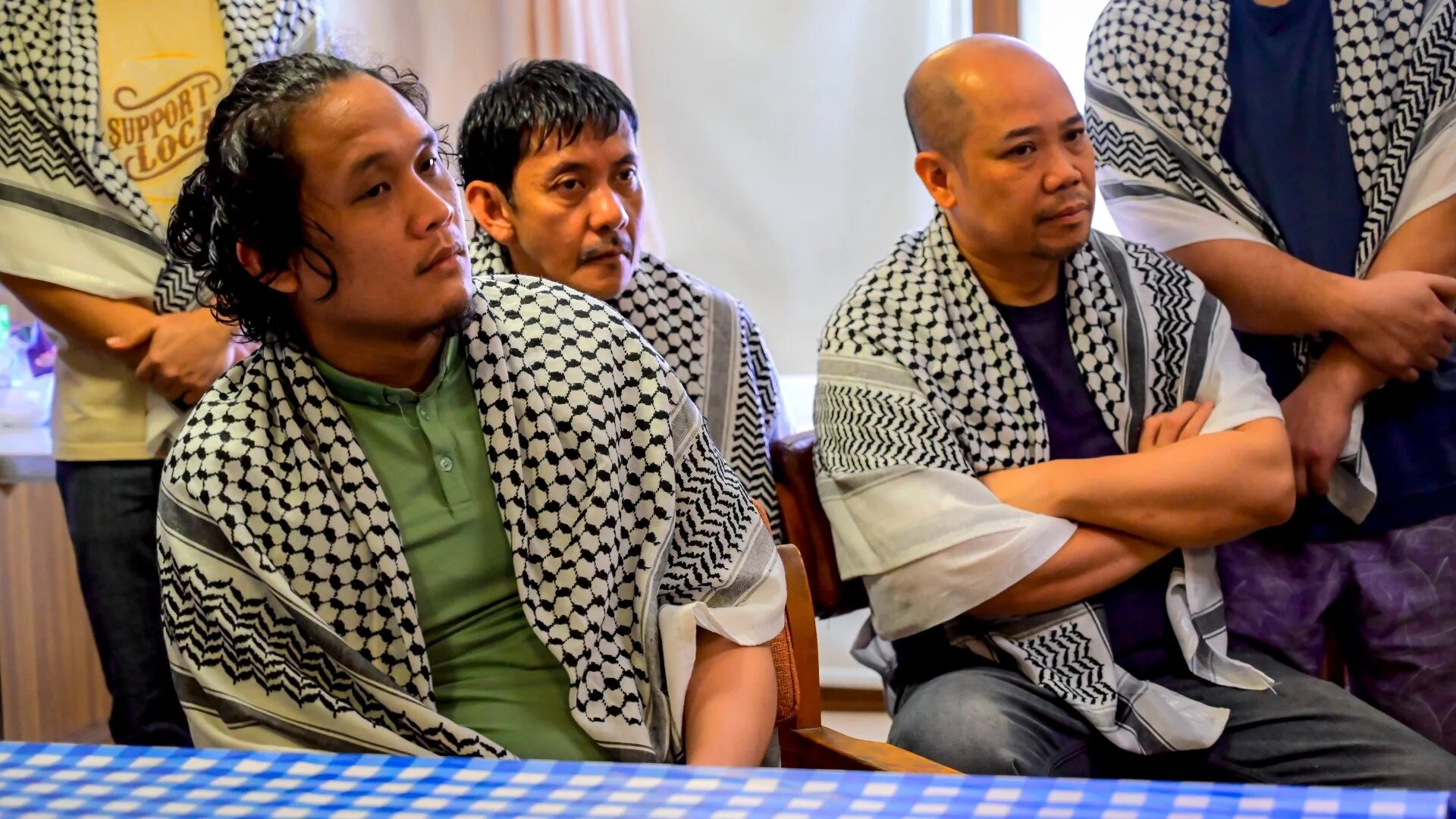 Captive crew members of the Israel-linked cargo vessel Galaxy Leader seized by Houthi fighters are gathered in the port city of Hodeidah, on 4 October 2024 (AFP)