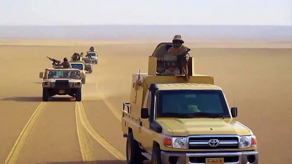 Egyptian army pickup trucks and humvees (High Mobility Multipurpose Wheeled Vehicles - HMMWVs) driving in the desert in North Sinai (AFP/Egypt Army)