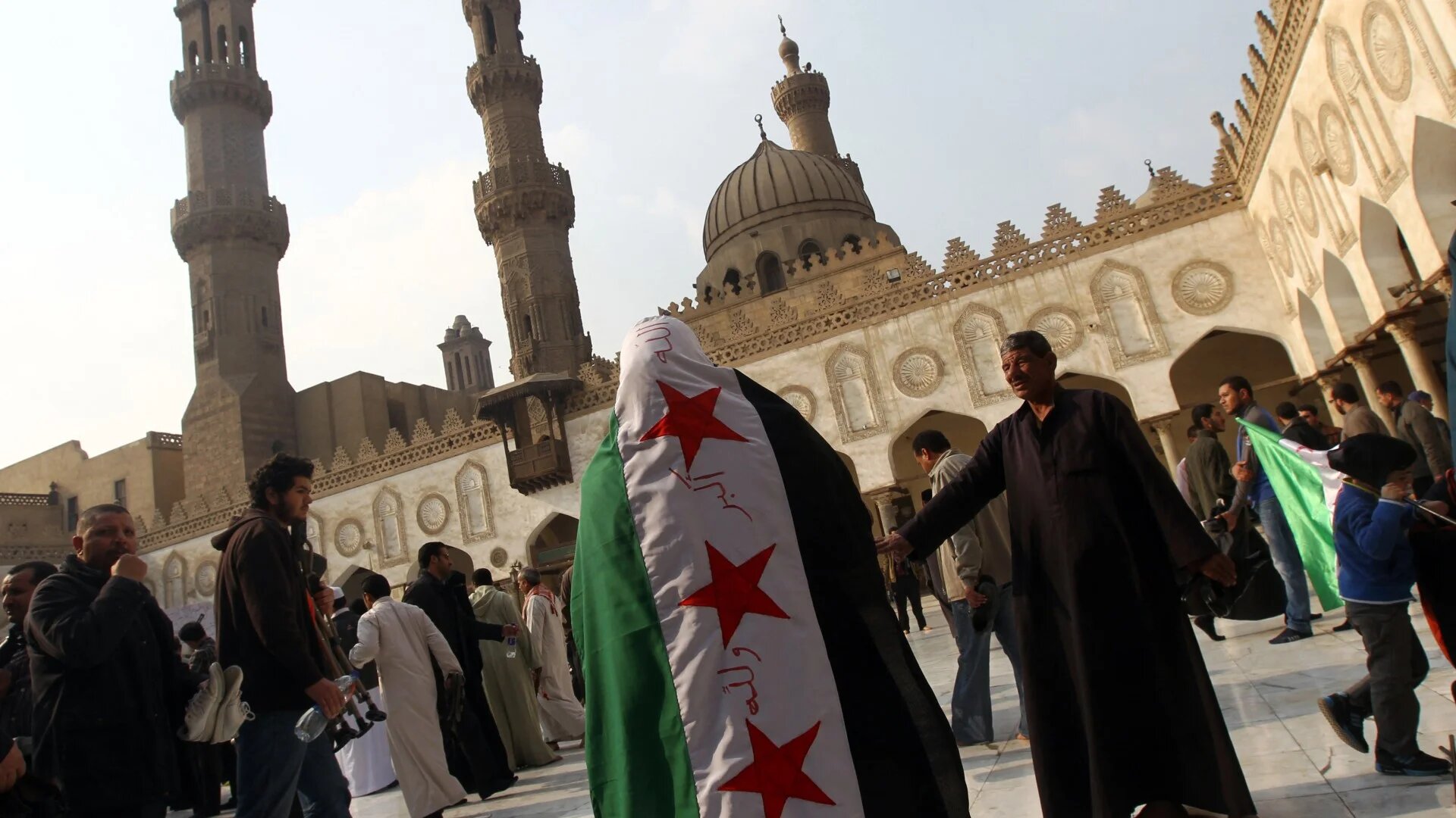 In this file photo from 28 December 2012, Egyptian protestors gather during a rally in support of the Syrian people and against Syria's President Bashar al-Assad at Al-Azhar mosque in Cairo (AFP)