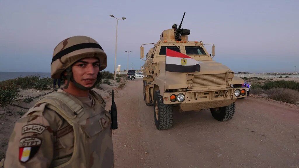 Egyptian soldiers patrol the Rafah-Gaza border on 11 December 2023 (Giuseppe Cacace/AFP)