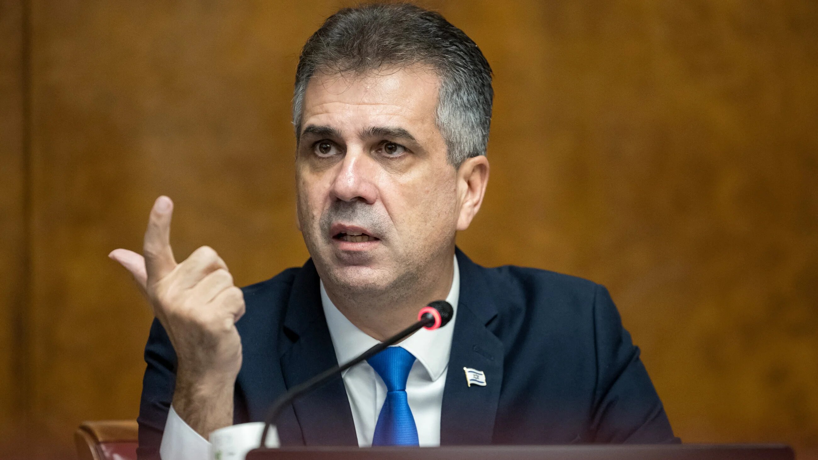 Israel's former foreign minister and current minister of energy and infrastructure, Eli Cohen, speaks during a press conference in Geneva on 14 November 2023 (AFP/Pierre Albouy)