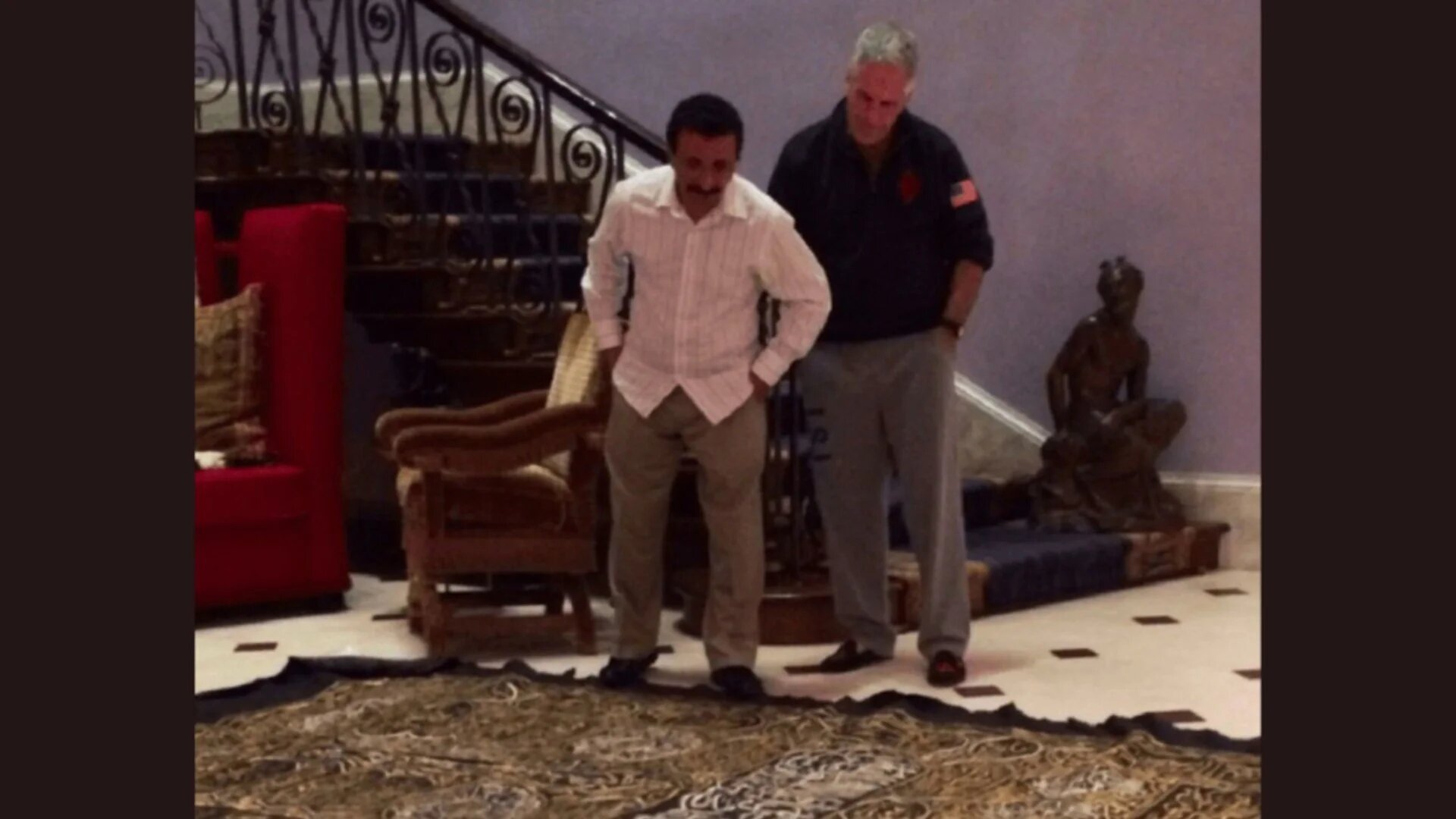 Sex offender Jeffrey Epstein and Emirati businessman Sultan Ahmed bin Sulayem look at what appears to be a sacred cloth from Mecca in Saudi Arabia (US Department of Justice)